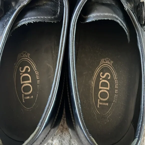 Tod’s black buckle loafers